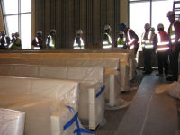 Auditorium seats have been wrapped for protection while auditorium construction is completed.