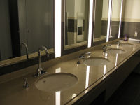 Sinks in bathrooms are equipped with faucets that are hands free.