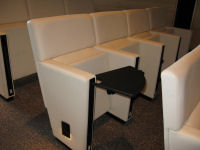 Auditorium seat with writing table extended.