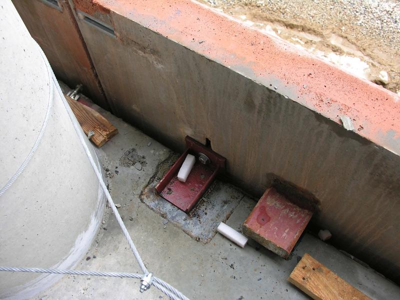 Bolt holding concrete facade panel to side of building