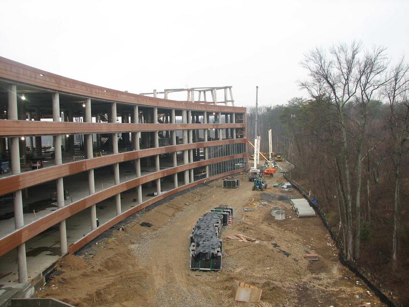 View of north (back) side of building. Windows are being installed at the far side.