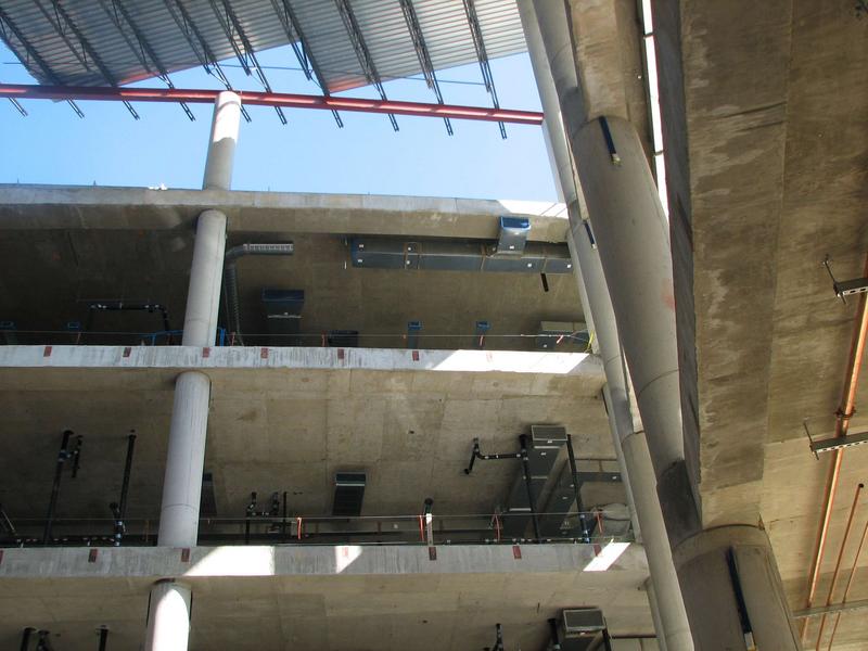 Looking up towards the atrium roof. The open area between the roof top and the first level below it will have windows to let the light into the atrium.