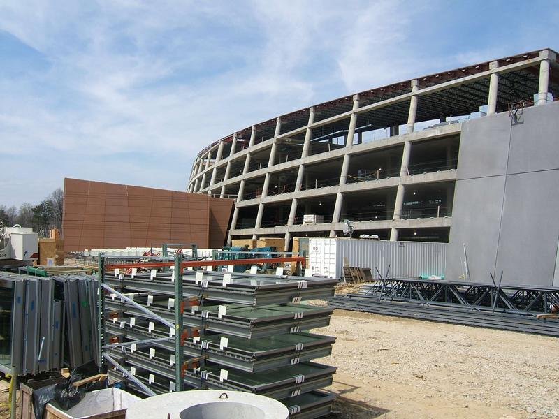 Front view with two story data center (red) to left and auditorium (gray) to right