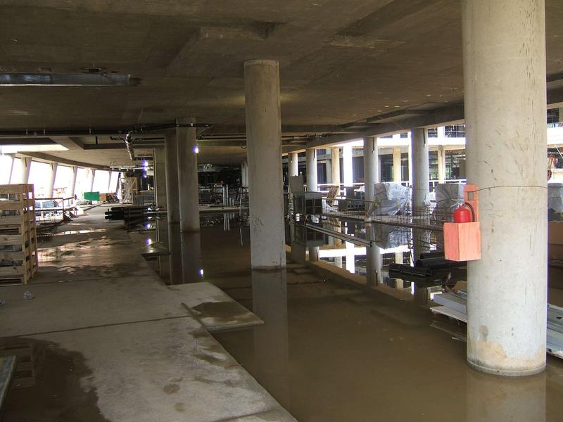 Interior of conference center with evidence of heavy rains