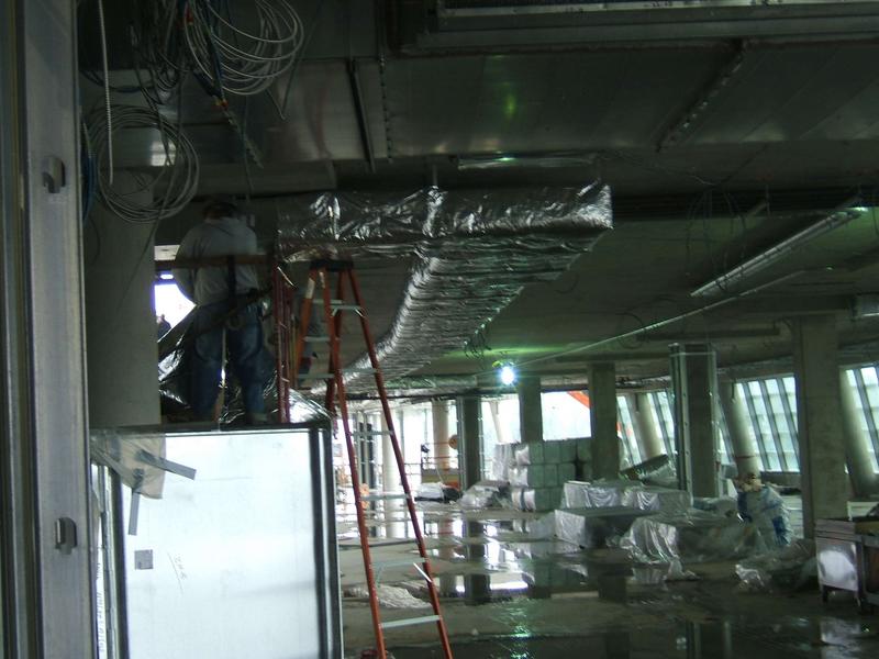 Insulating ductwork on second floor front wing.