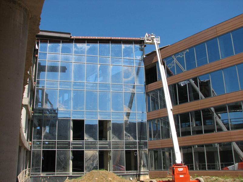 Courtyard area showing east wall of atrium with glass almost completely installed