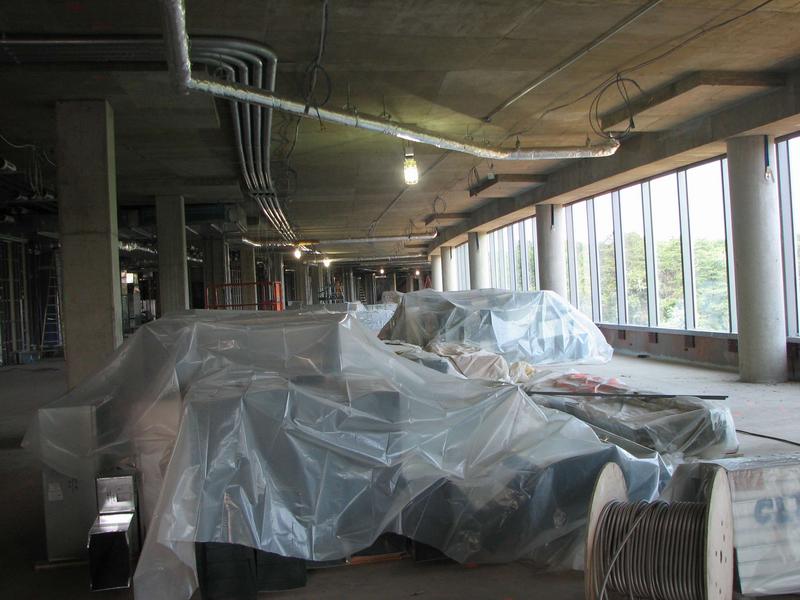 Fourth floor operations area looking west. The plastic covers metal ductwork.