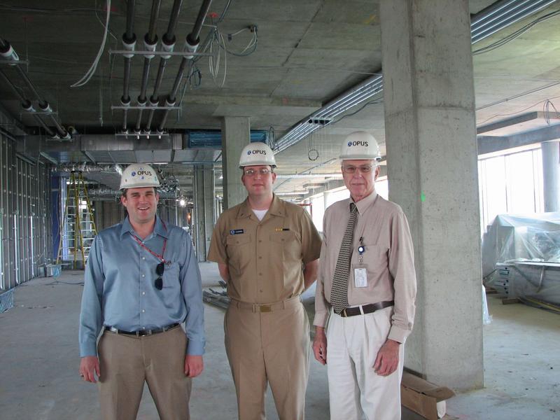 Mike Brennan, Matt Glazewski and Dave Feit look over the fourth floor HPC/OPC operations area
