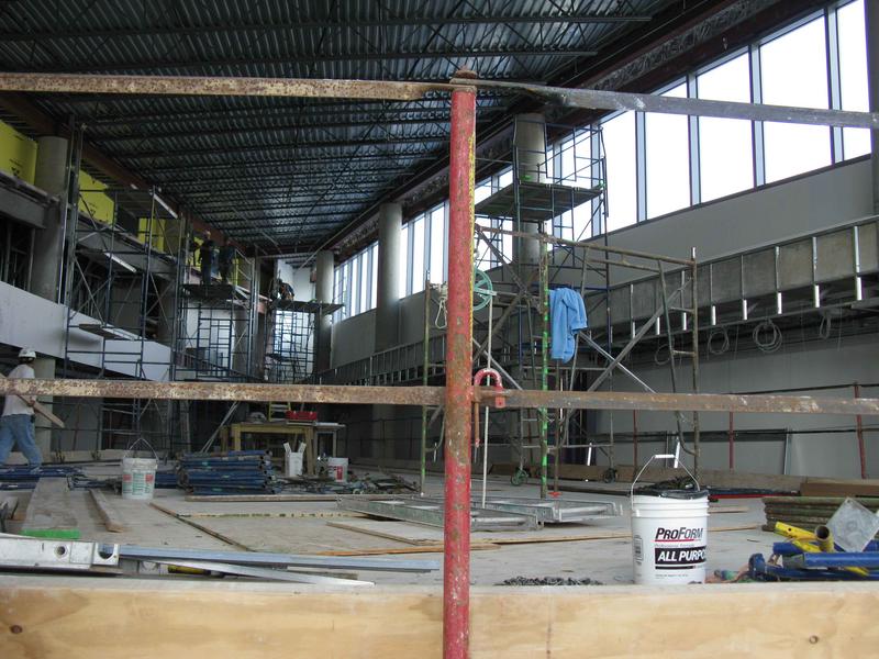 Finish work proceeding in upper atrium area (top of scaffolding)