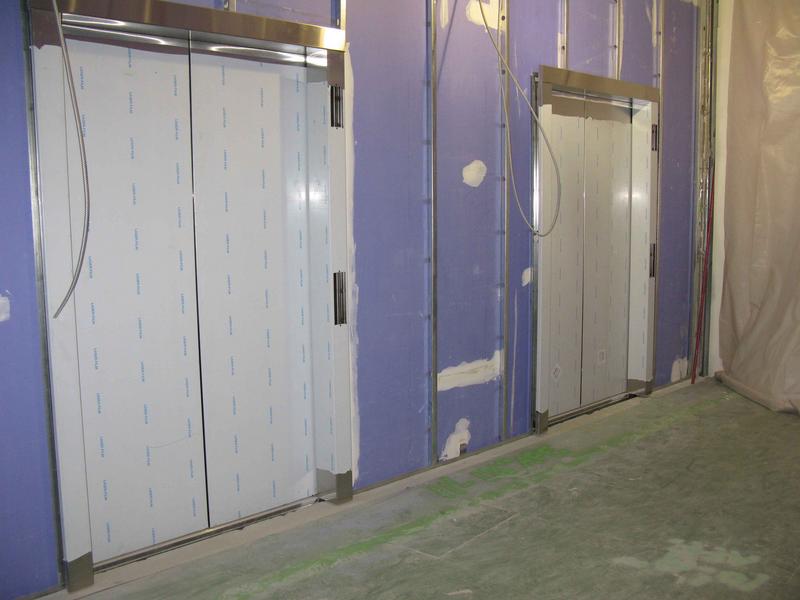 Elevator doors installed on main elevators