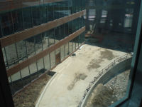 View from the 4th floor overlooking the bio-retention pond and outdoor dining area.