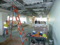 An eastward look into the HPC and OPC operations floor toward the parking garage. Workers are currently wiring for the installation of the 