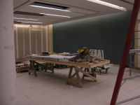 Meeting room under construction next to auditorium (note fabric covered wall).