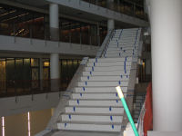 Floating stairway in atrium. Note that stair surfaces have been installed.