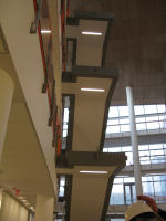 Lights installed in floating stairway in atrium.