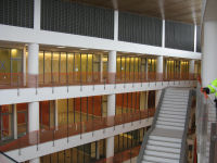 Conference rooms line the south side of the atrium on floors 2, 3, and 4.