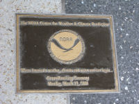 Plaque in floor of atrium showing where time capsule is buried.