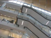 Looking upwards toward floating staircase in atrium.