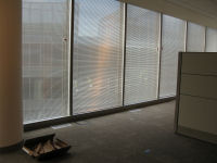 Blinds installed on outside facing windows on third floor.
