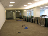 Another view of EMC second floor area with stacked cubicle panels.