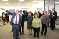 NCEP Director Uccellini pointing out building features to tour participants.